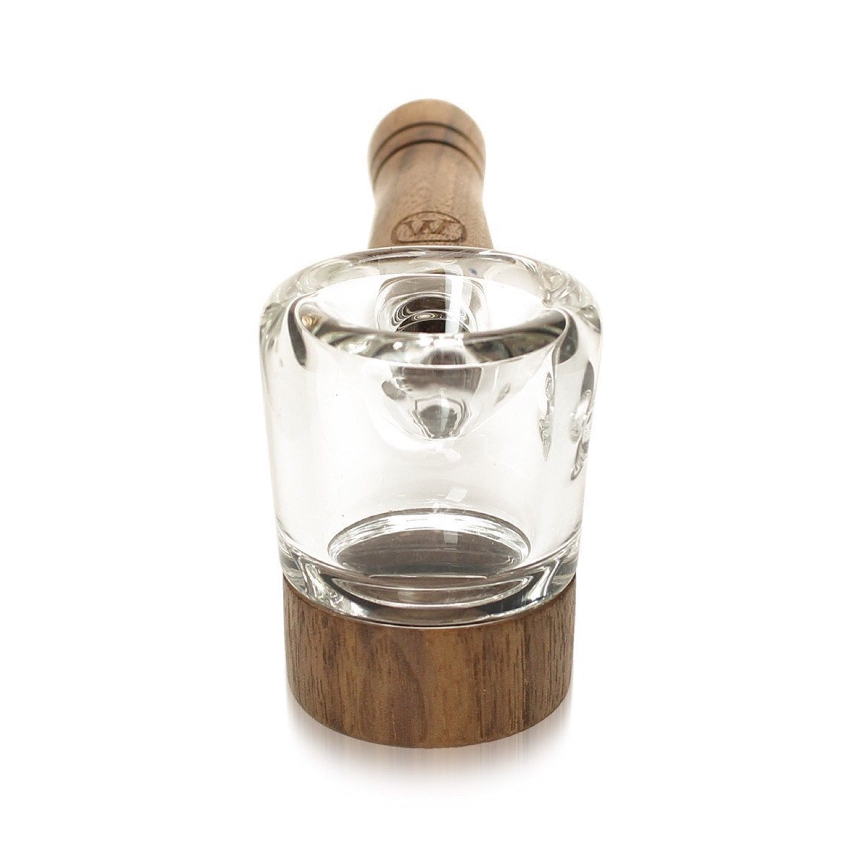 a glass bottle with a wooden stopper